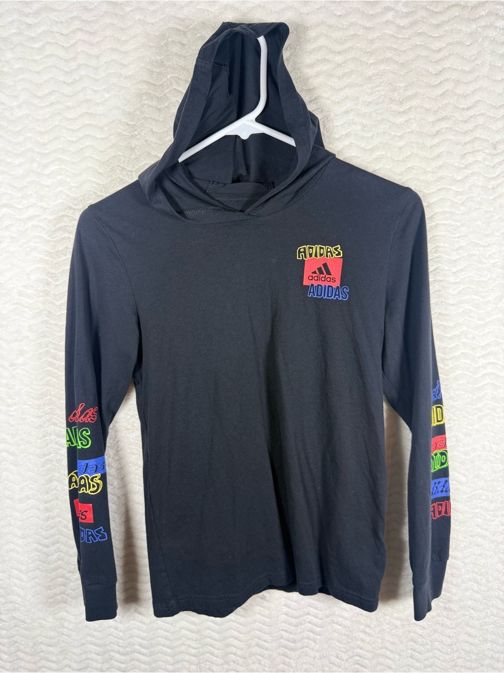 Adidas Kids' Black Hooded Long Sleeve Logo Tee. Such a vibe 😎🧡